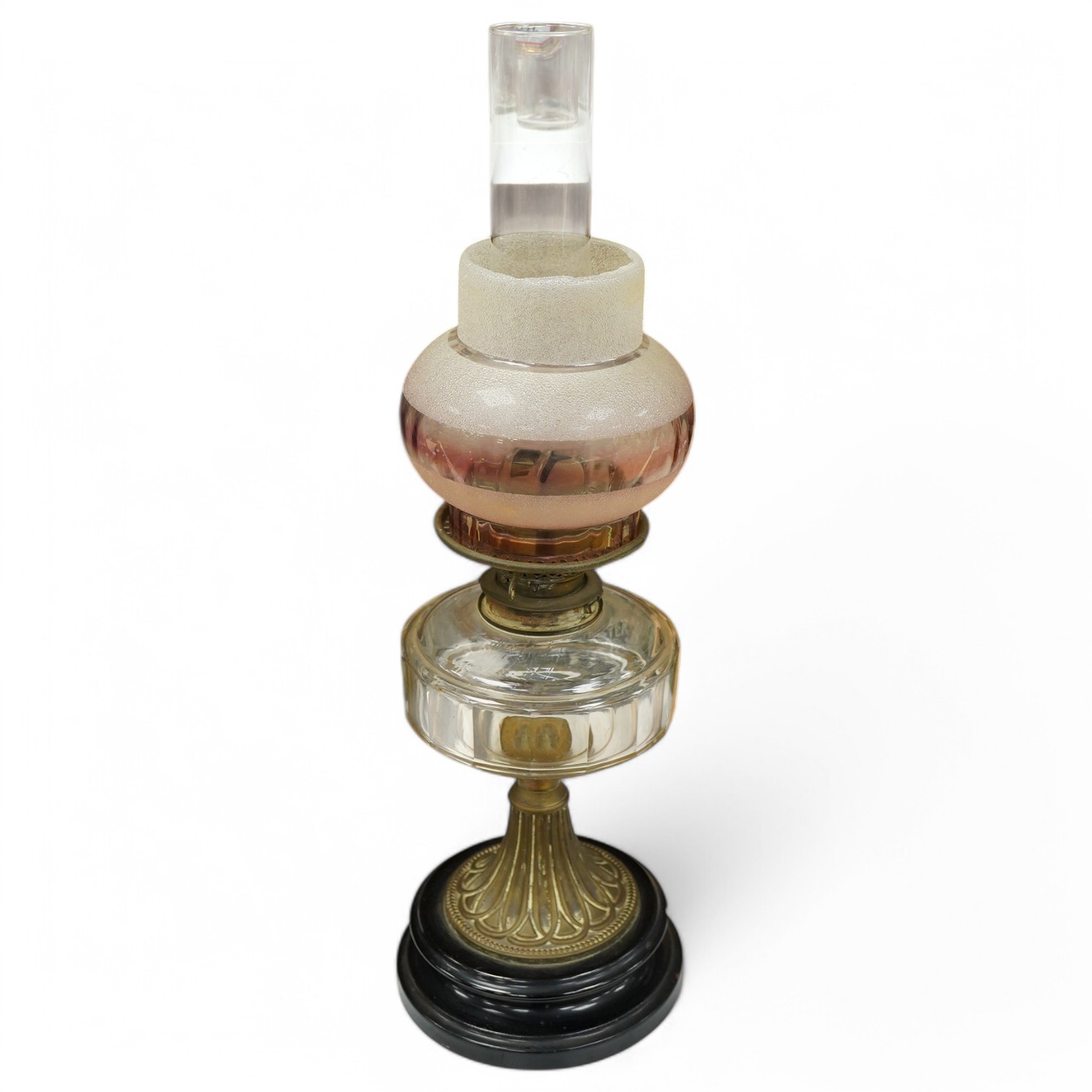 A late 19th century brass and glass oil lamp with later shade, 56cm high. Condition - chip to base and shade cut down